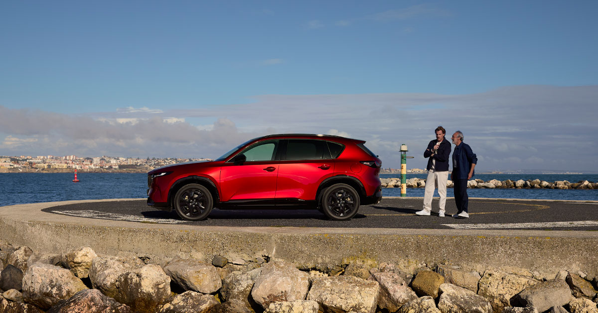 A Mazda CX-5 crossover SUV parked by a body of water